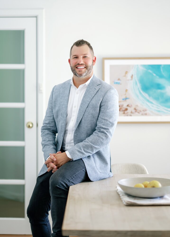 Blake Lieschke Profile Commercial Property Management Perth About Page Portrait Image Sitting On Table